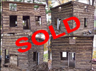 Baltimore log cabin with original openings and cantilevered top log.